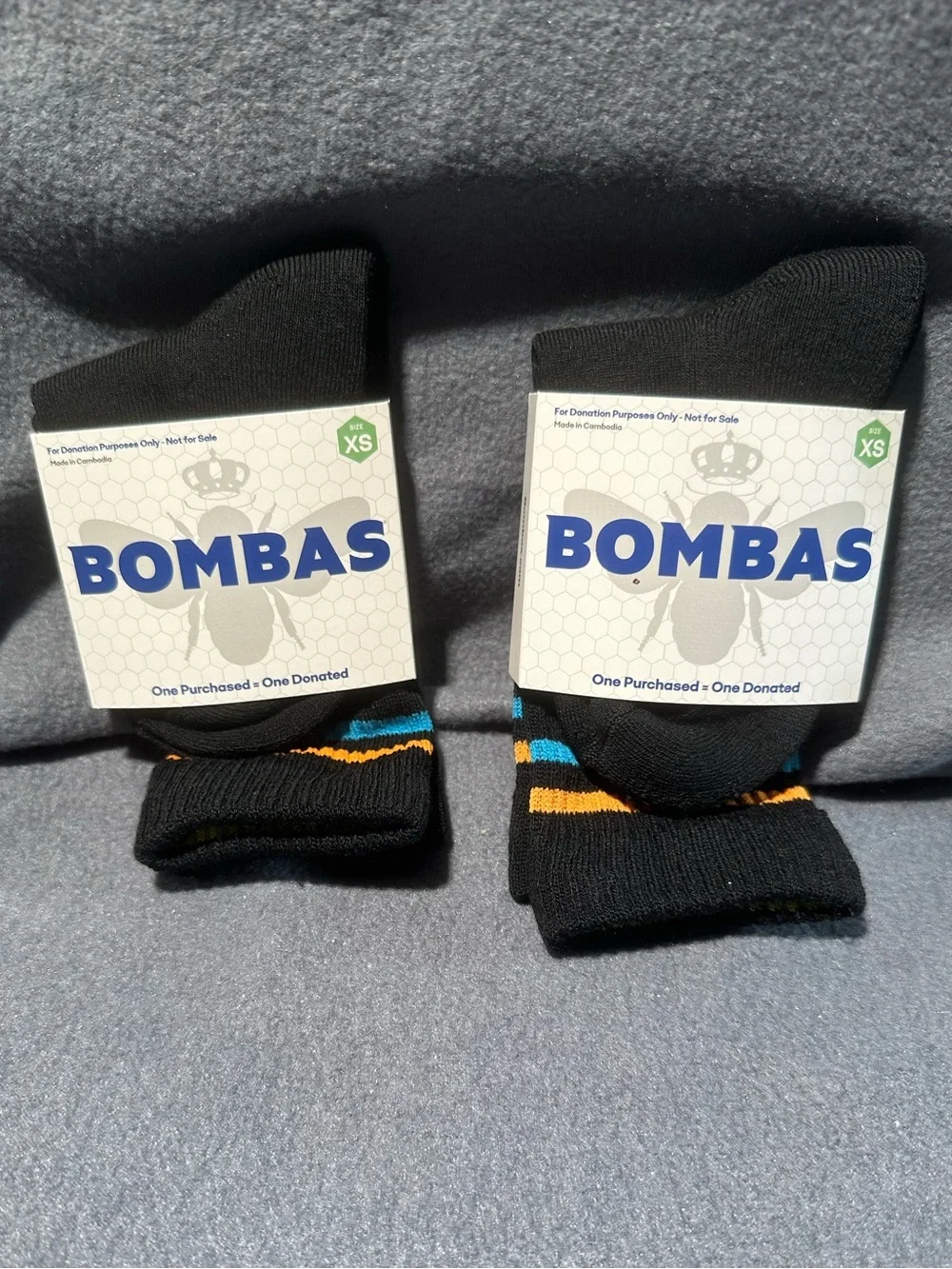 Bombas Black Crew Socks with Blue and Orange Stripe Accents